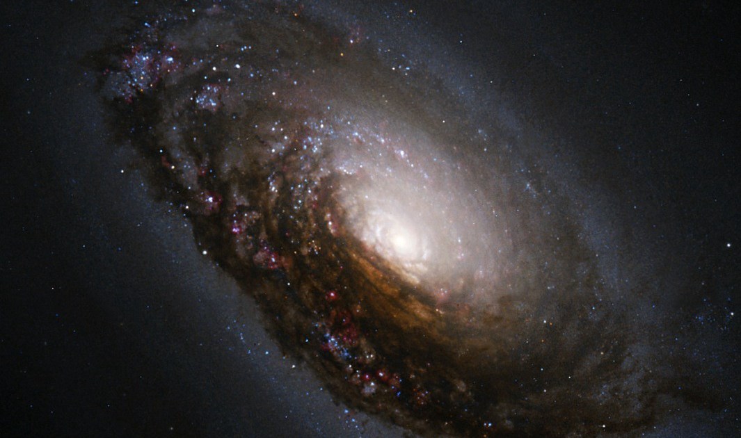 Mystery Solved: Why some galaxies appear darker on one half - Big Think