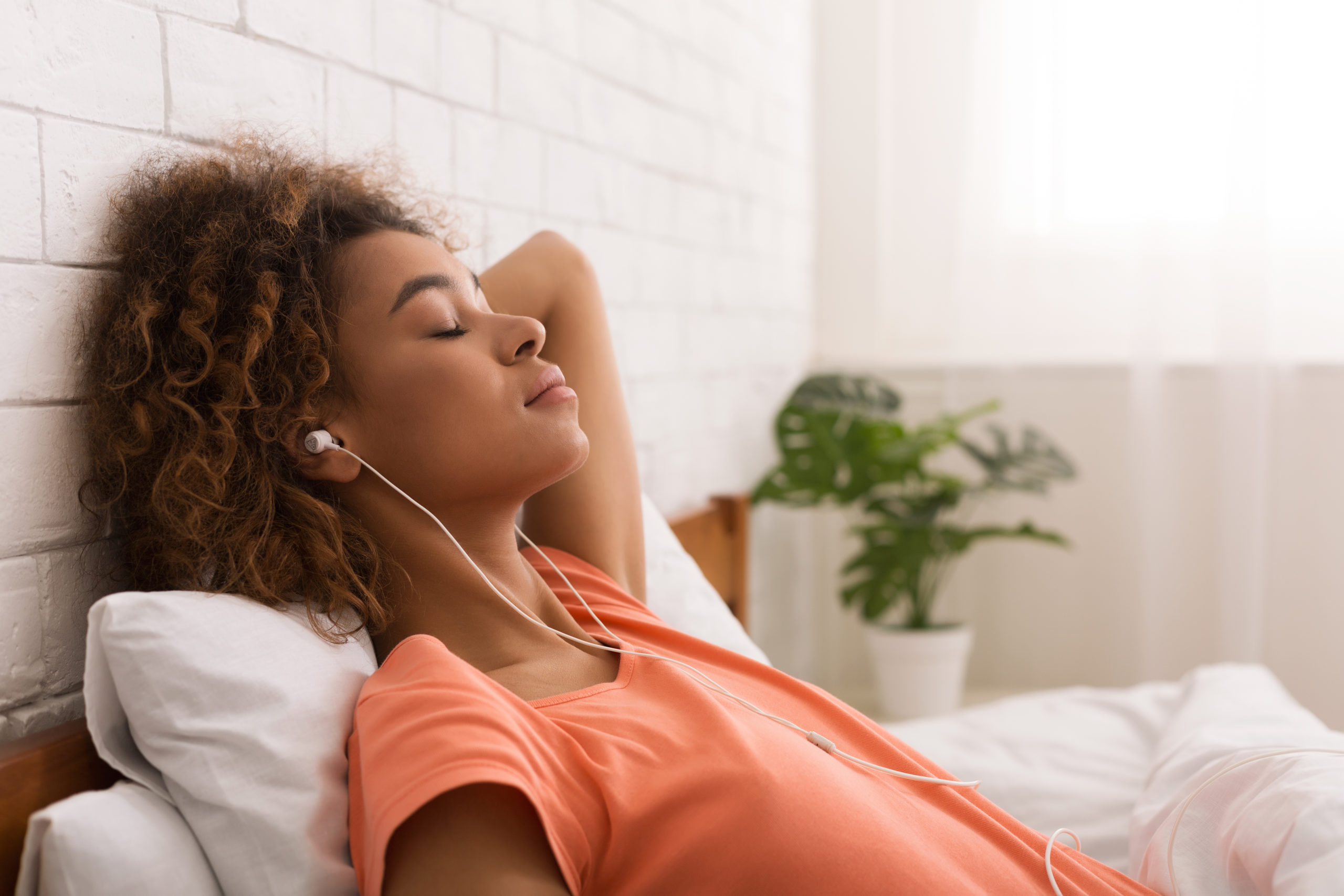 Women relaxes while listening to music.