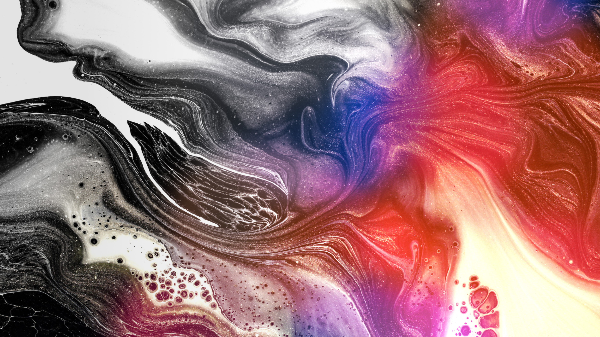 Abstract image with swirling black, white, red, blue, and orange colors resembling marbled patterns and fluid motion.