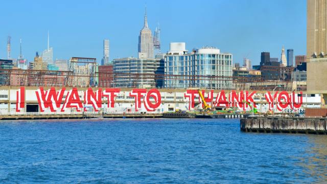 An urban area with the words 'I want to thank you' spraypainted on a wall illustrating why we should be grateful