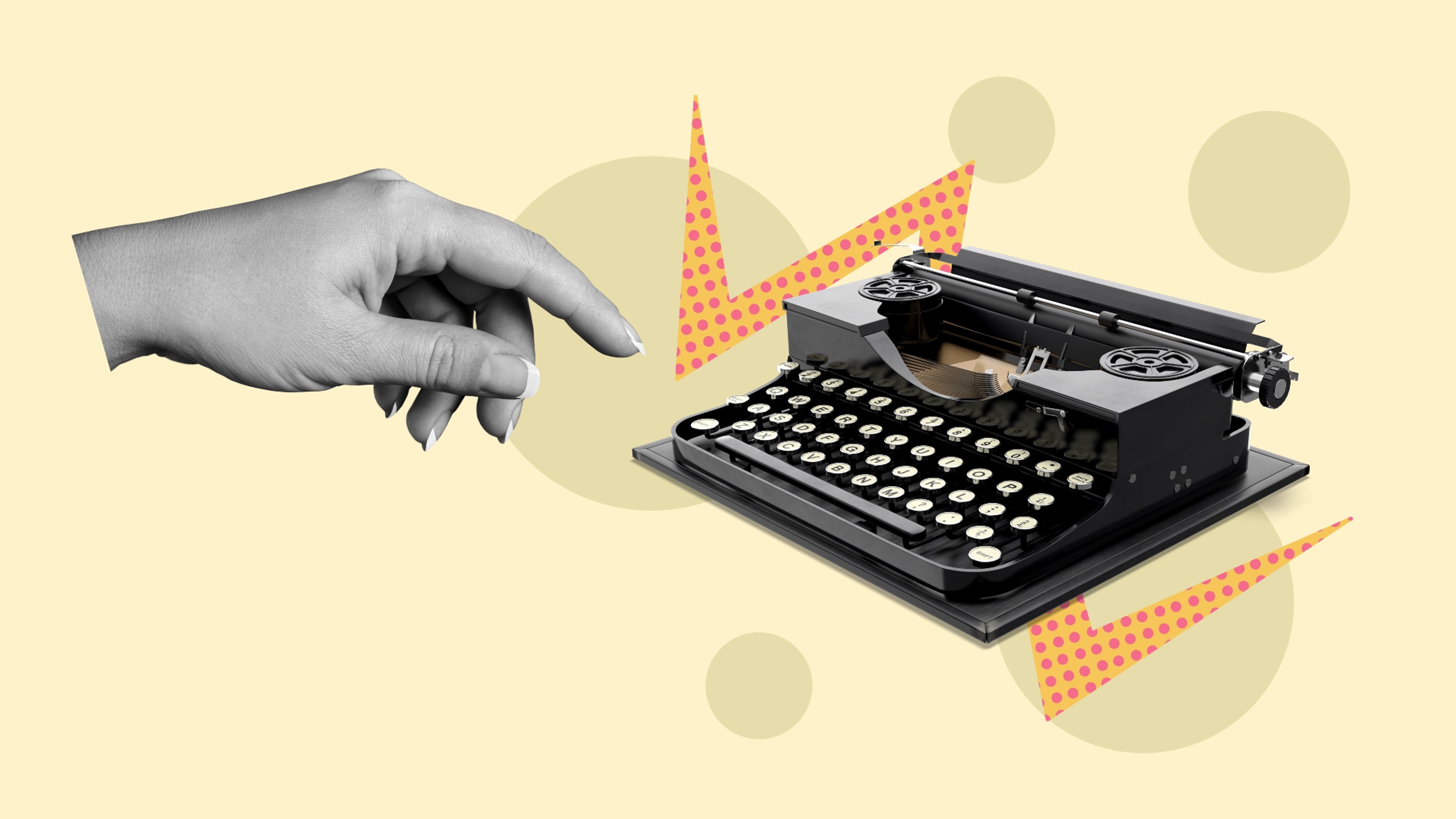 A hand reaching for a typewriter