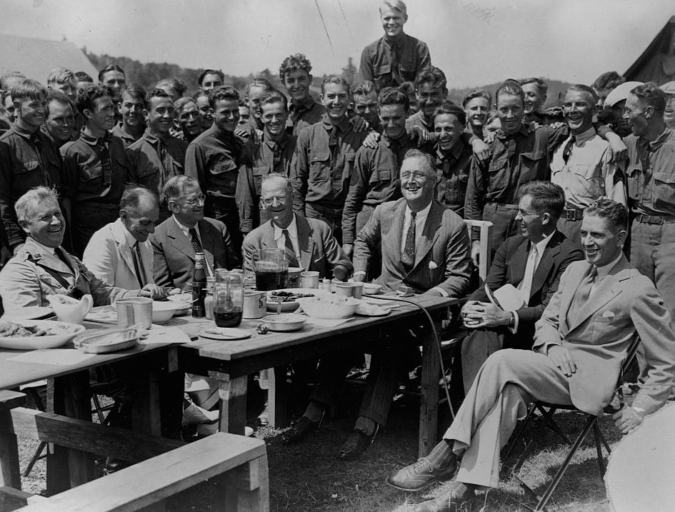 A black-and-white photo of FDR and several others