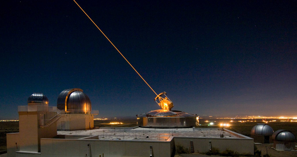 A laser directed at the night sky