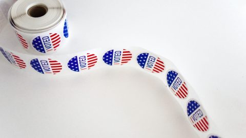 a roll of patriotic ribbon on a white surface.