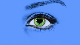 a close up of a person's green eye.