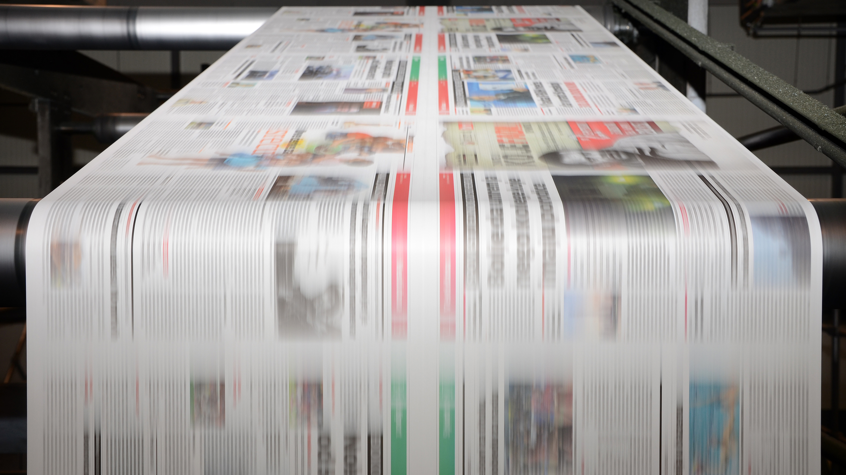 newspapers on a printing press