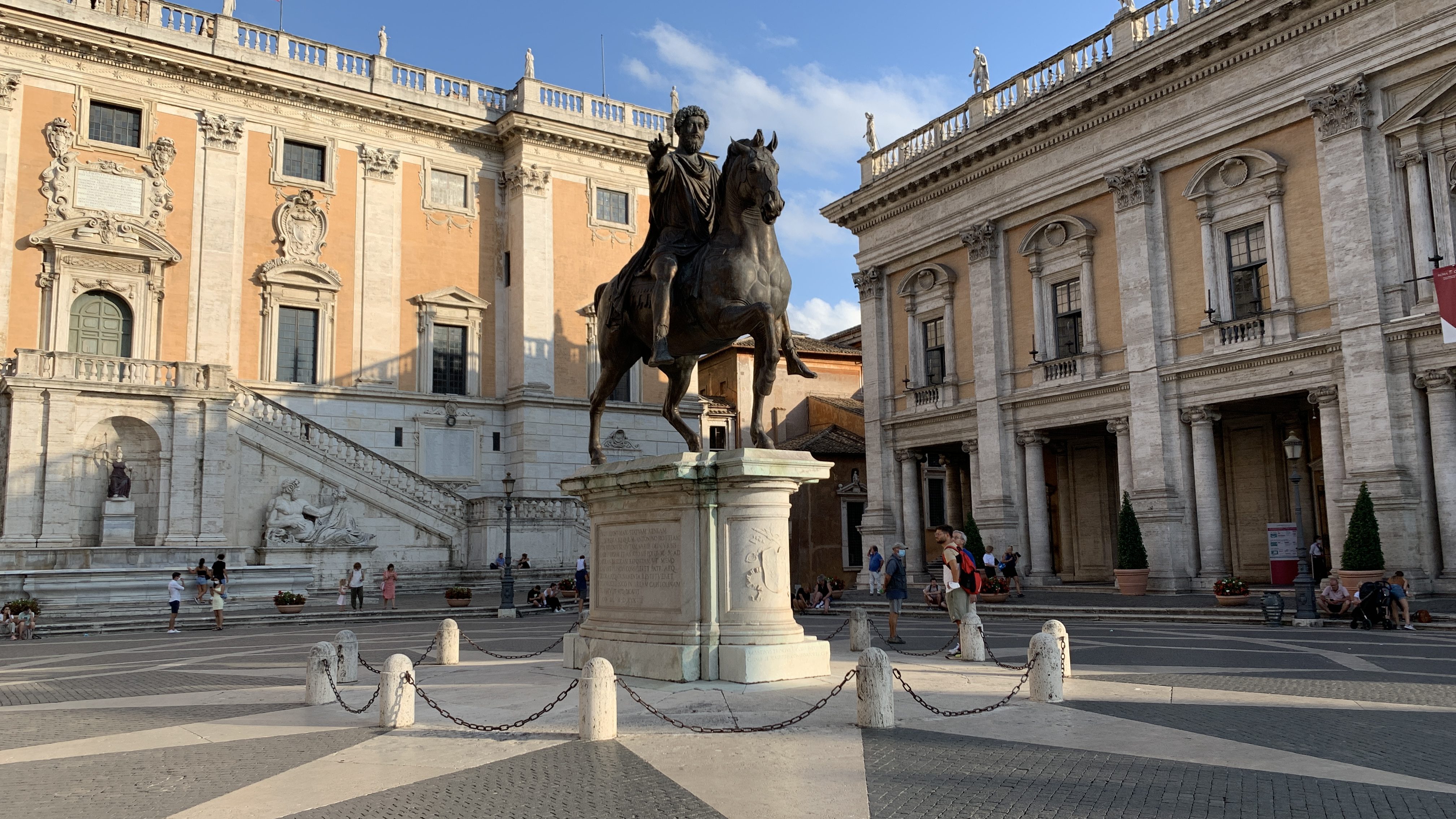 A statue of Marcus Aurelius in a Roman plaza.