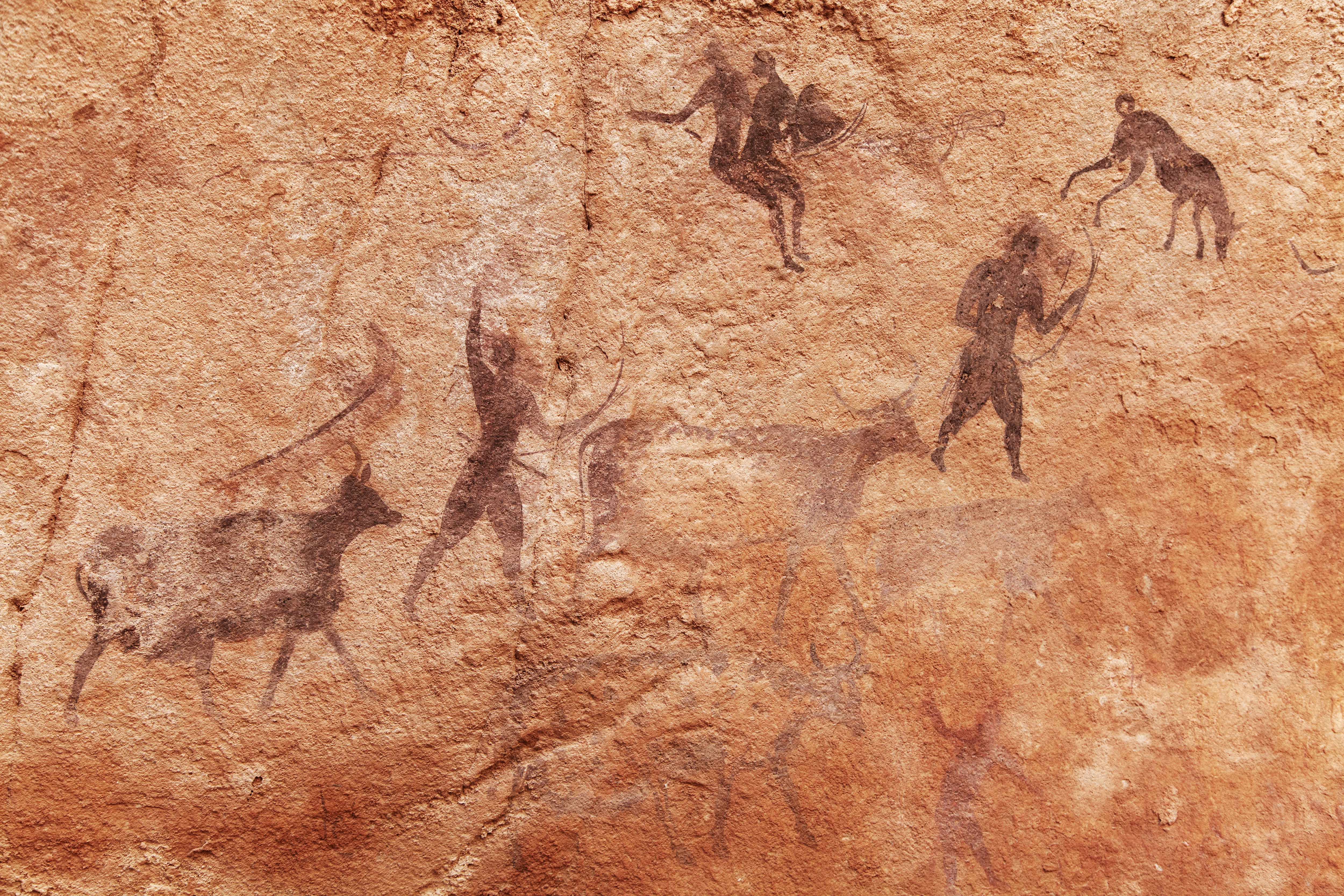 A rock painting from Tassili N'Ajjer, Algeria, showing prehistoric life.