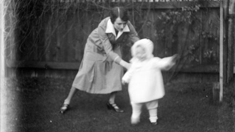 a black and white photo of a woman and a child.