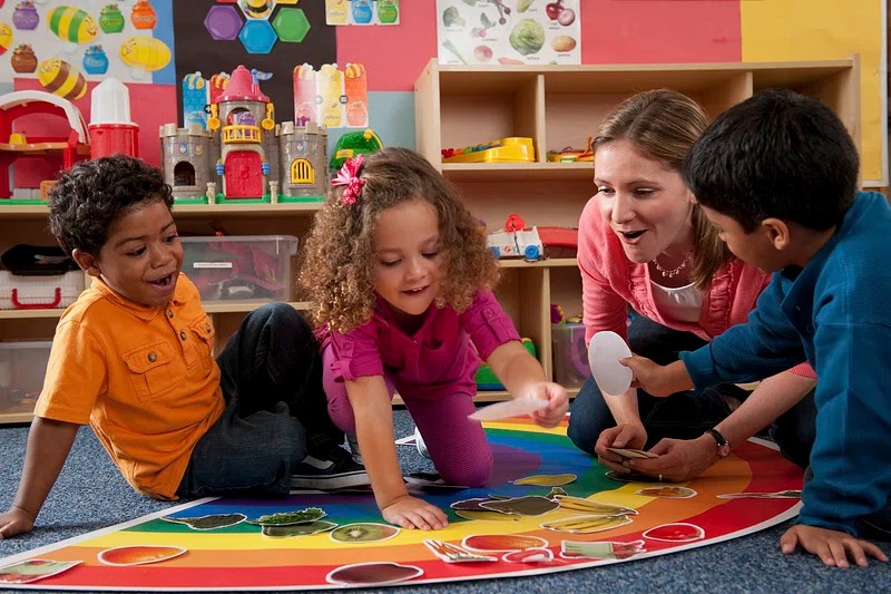 children playing in a nursery school environment