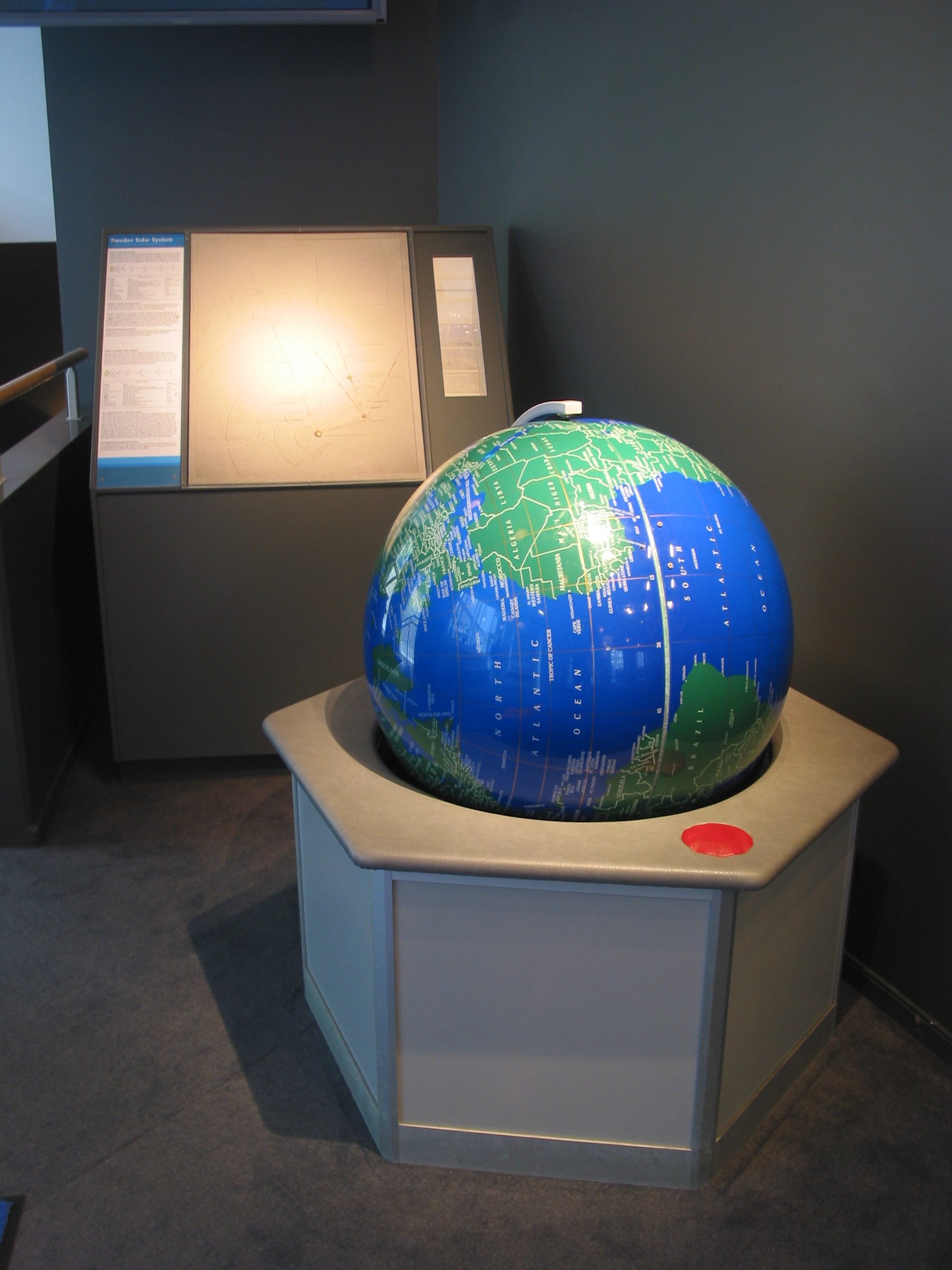 a blue globe on a pedestal.