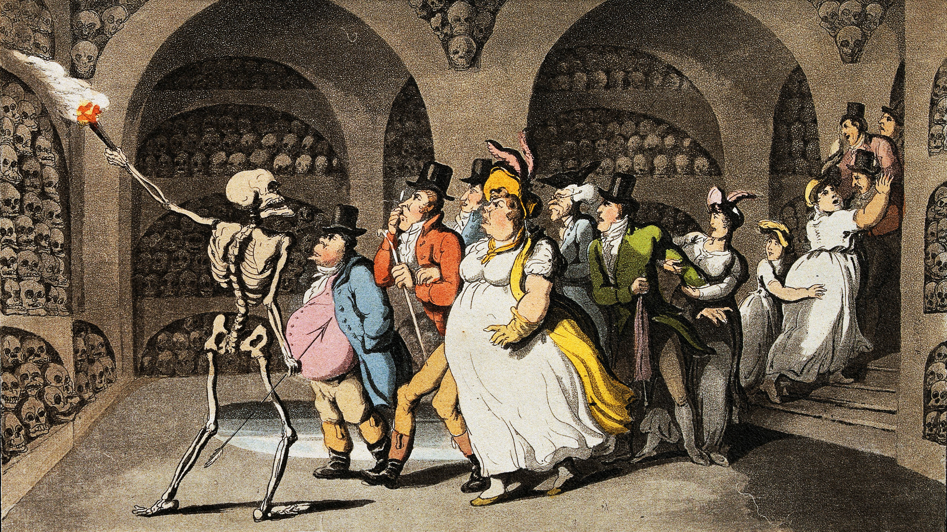 A group of people engaged in dark humor while standing around a skeleton.