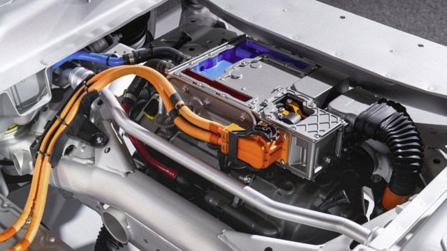 Challenges conventional electric vehicle myths by highlighting a car with an attached battery.