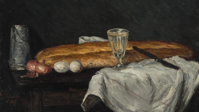 A painting of bread, eggs and a glass of wine.