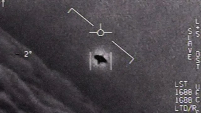 An image of a plane flying in the sky during a congress.
