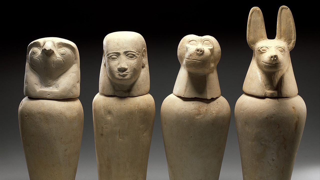 Four egyptian sarcophagi with animal heads emitting the smell of ancient Egyptian mummies.