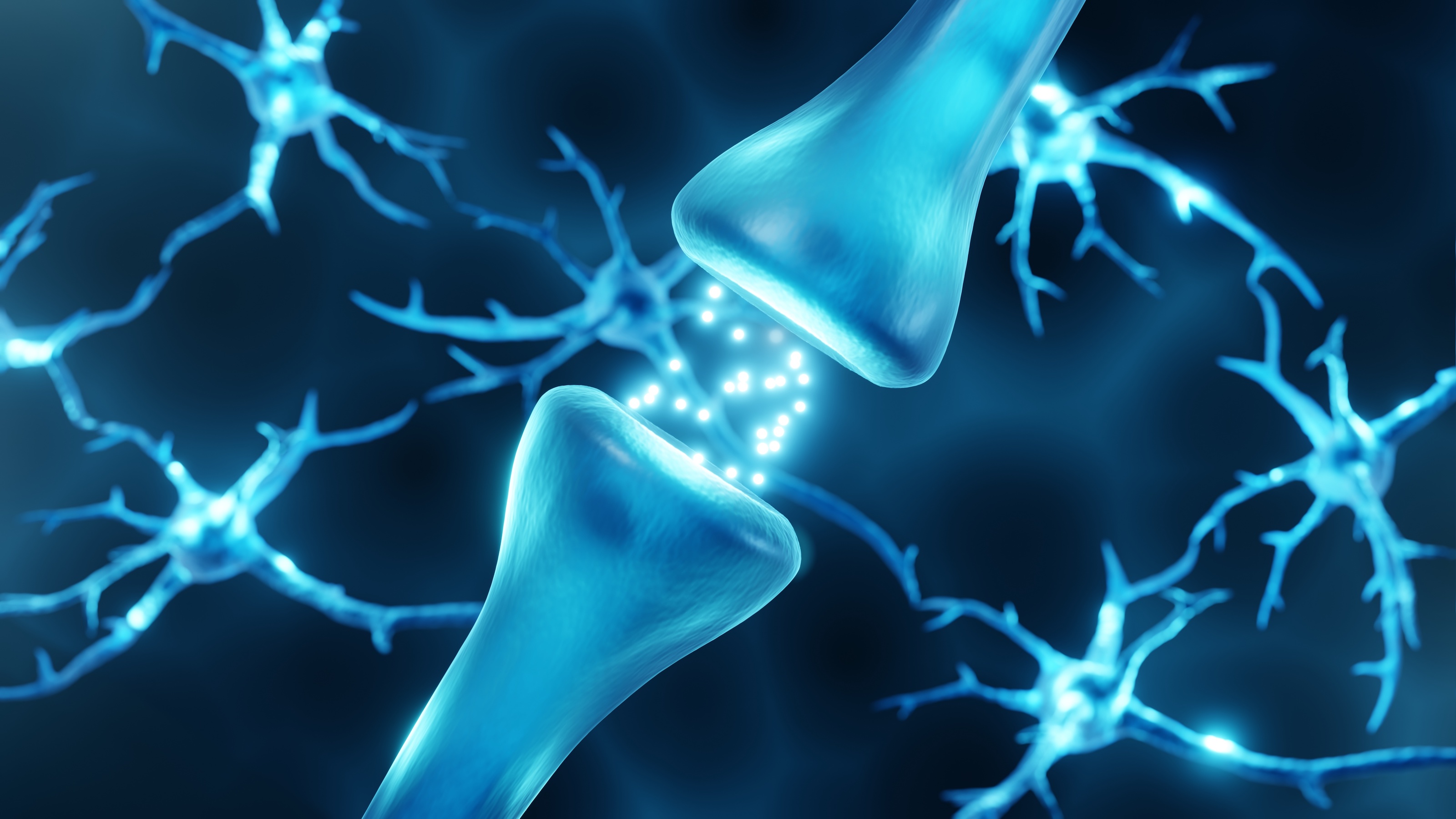 An image of a neuron with a blue light coming out of it.