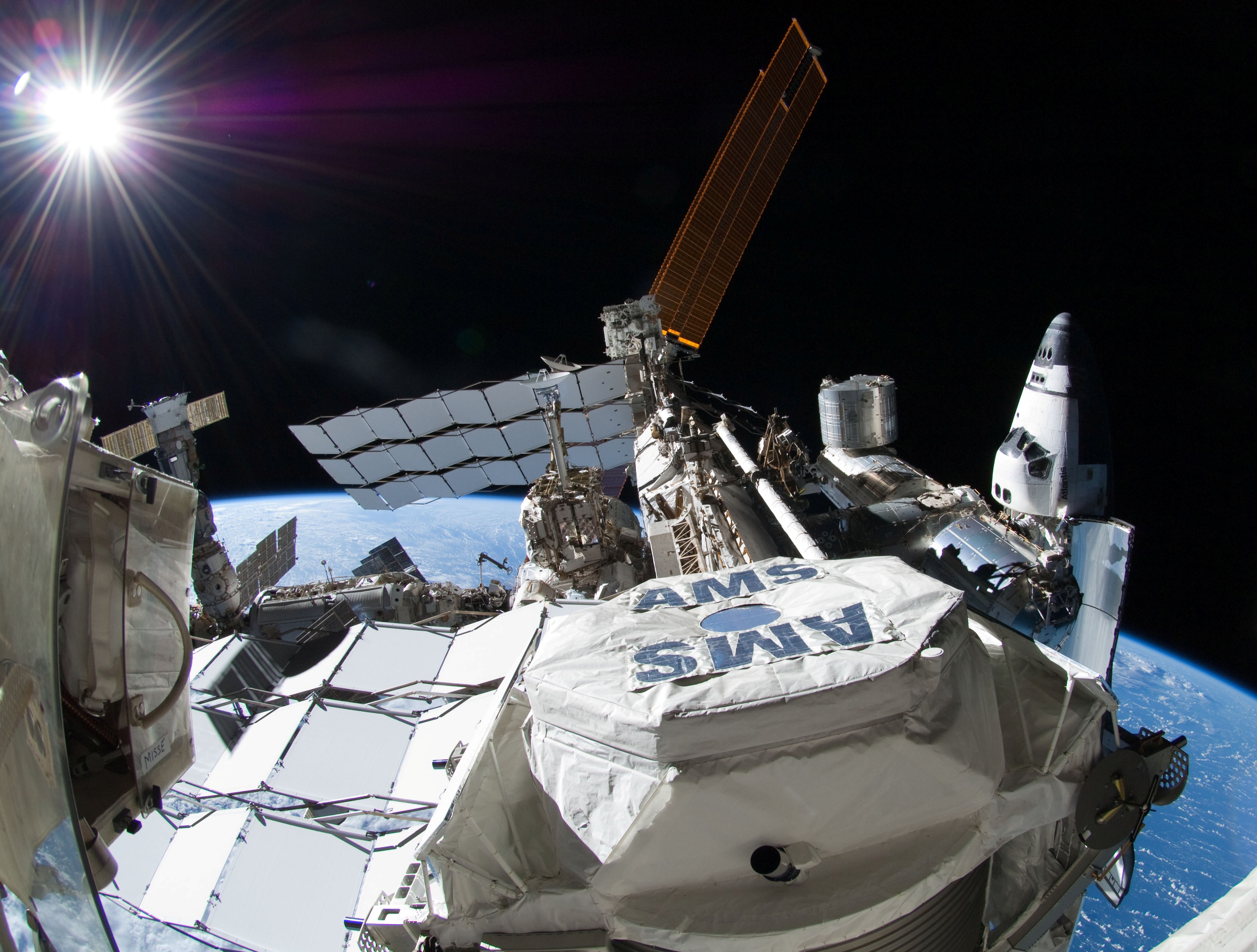 Nasa space station in space with alpha magnetic spectrometer