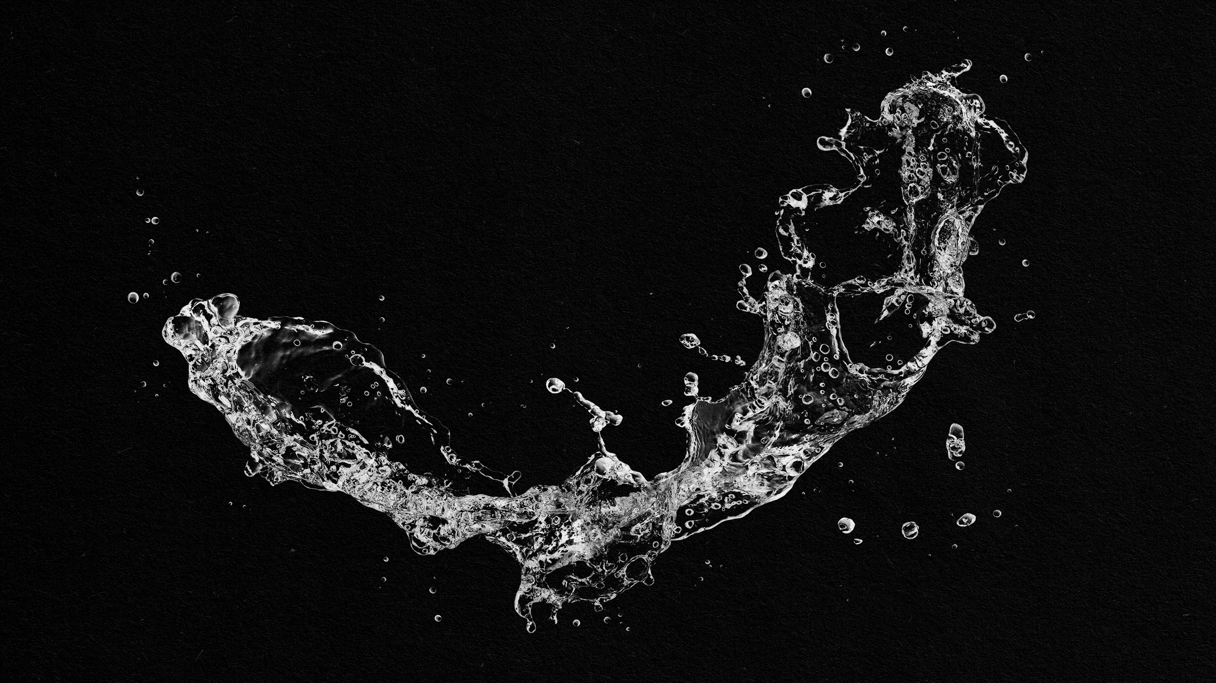 A squirting water splash on a black background.