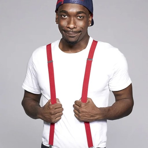 A man wearing suspenders and a hat.