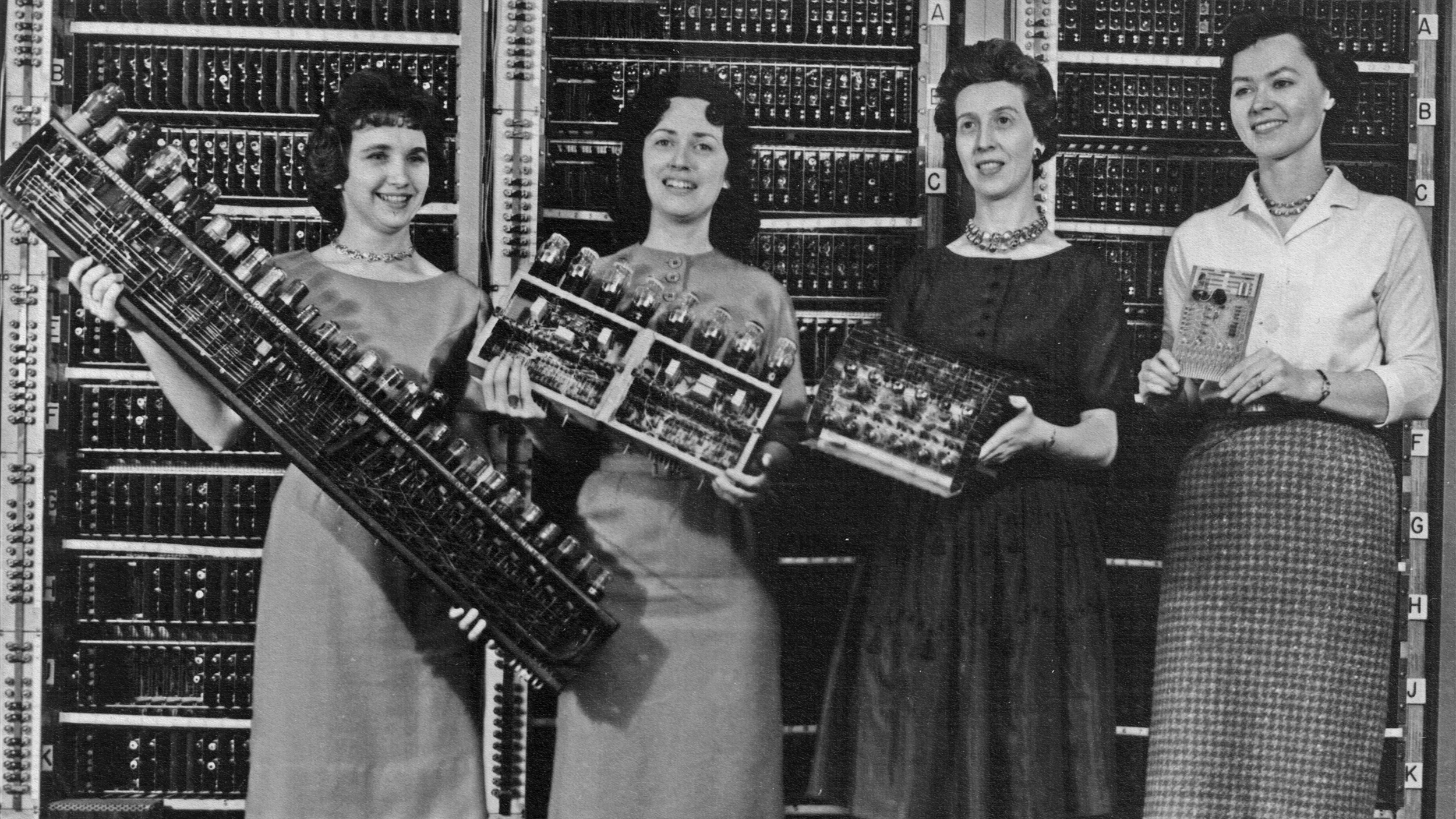 A group of women adopting new technologies.