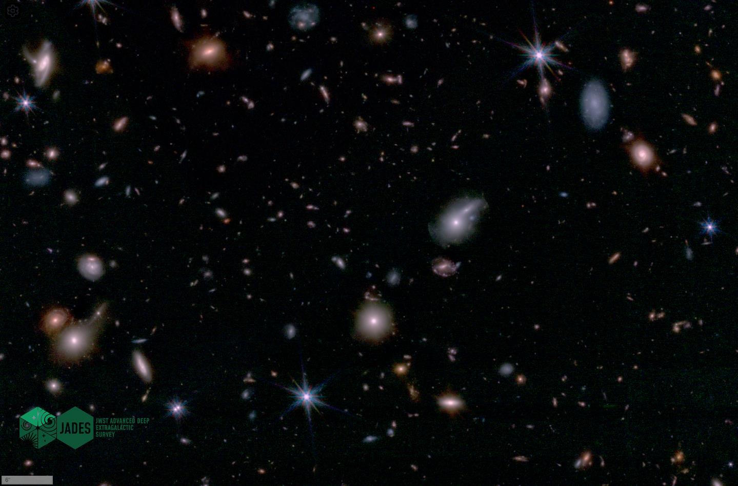 The JWST captures the deepest view of a dark night sky, revealing a large group of galaxies.