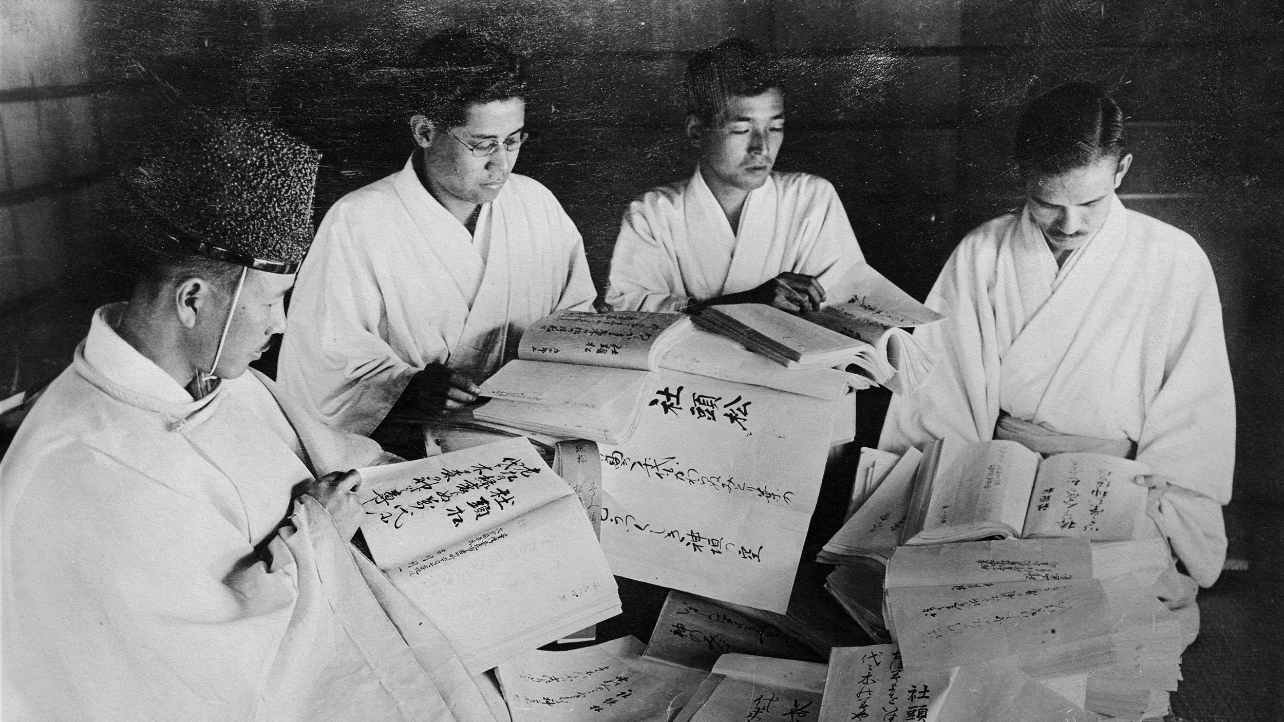 A group of men studying Japanese philosophy.