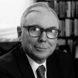 A black and white photo of a man in glasses.