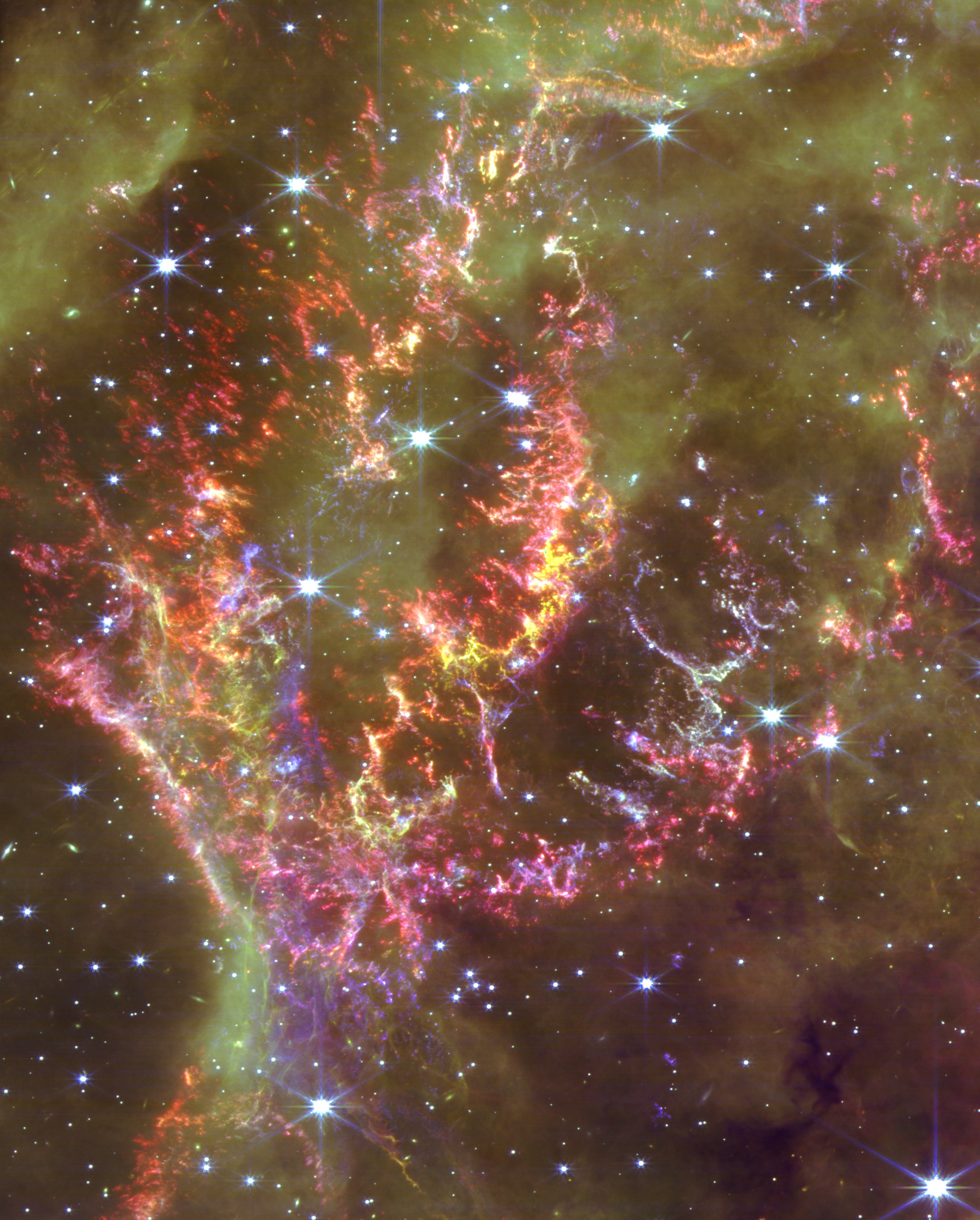 NASA image of JWST Cas A, supernova remnant showing stars and nebula.