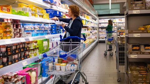 A woman shopping in an ALDI grocery store.
