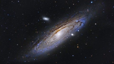 An image of a spiral galaxy in the night sky.