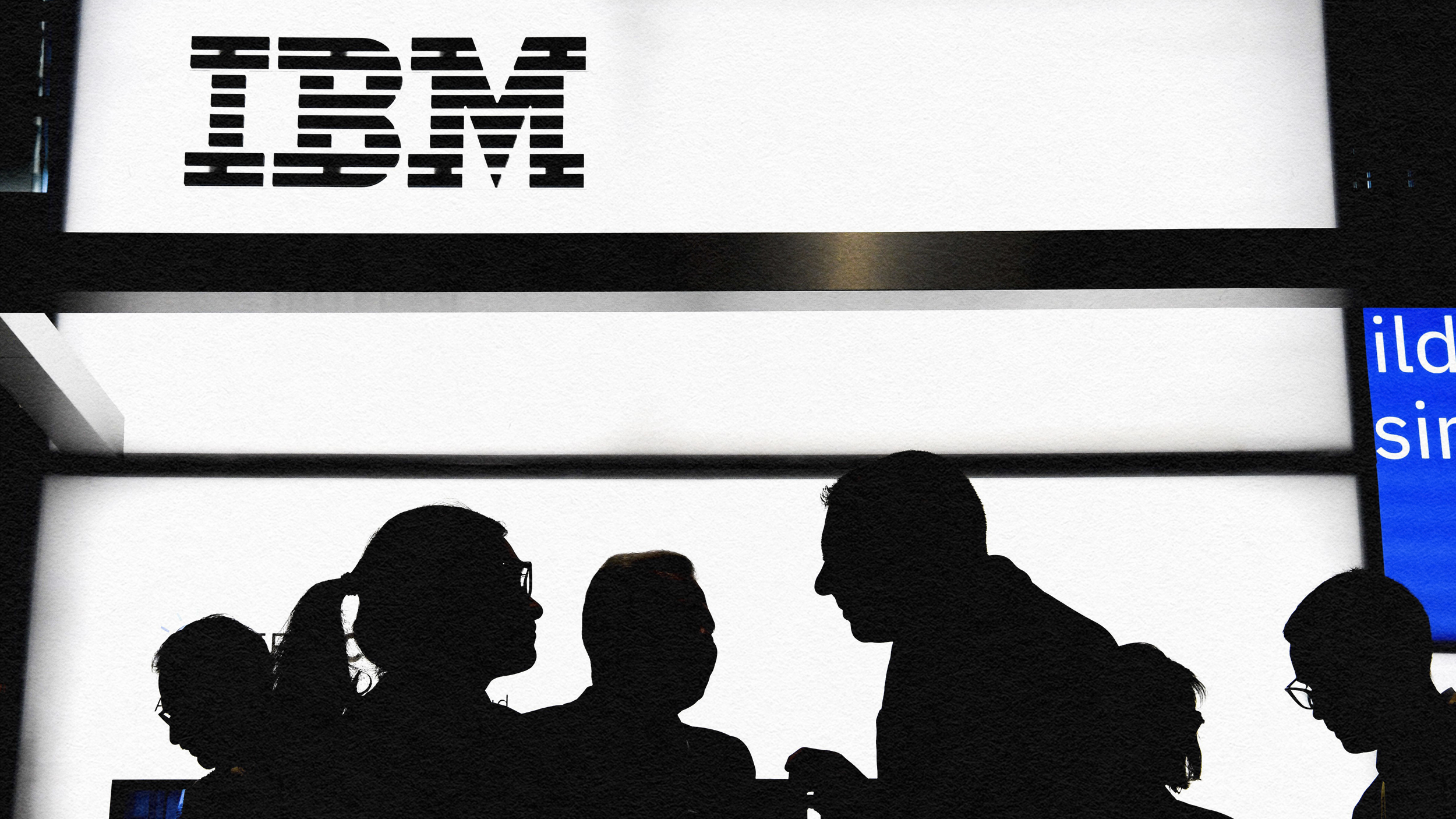 Innovation leaders standing in front of the ibm logo.