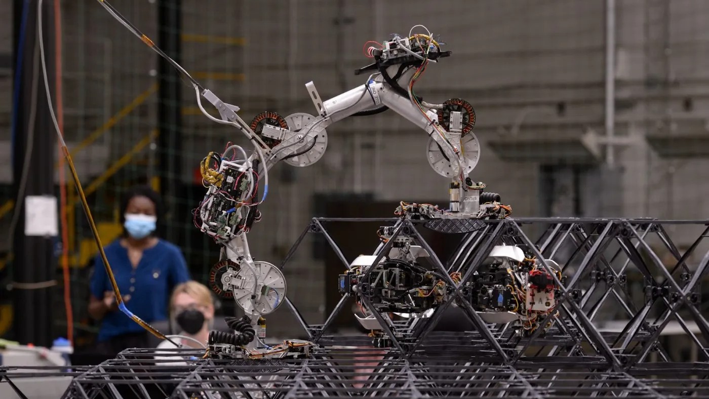 A robot is being built in a factory.