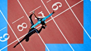 An image of a person running on a track with great conatus.