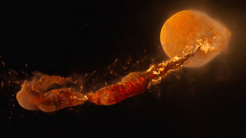 An image of a fireball emerging from a dark background.
