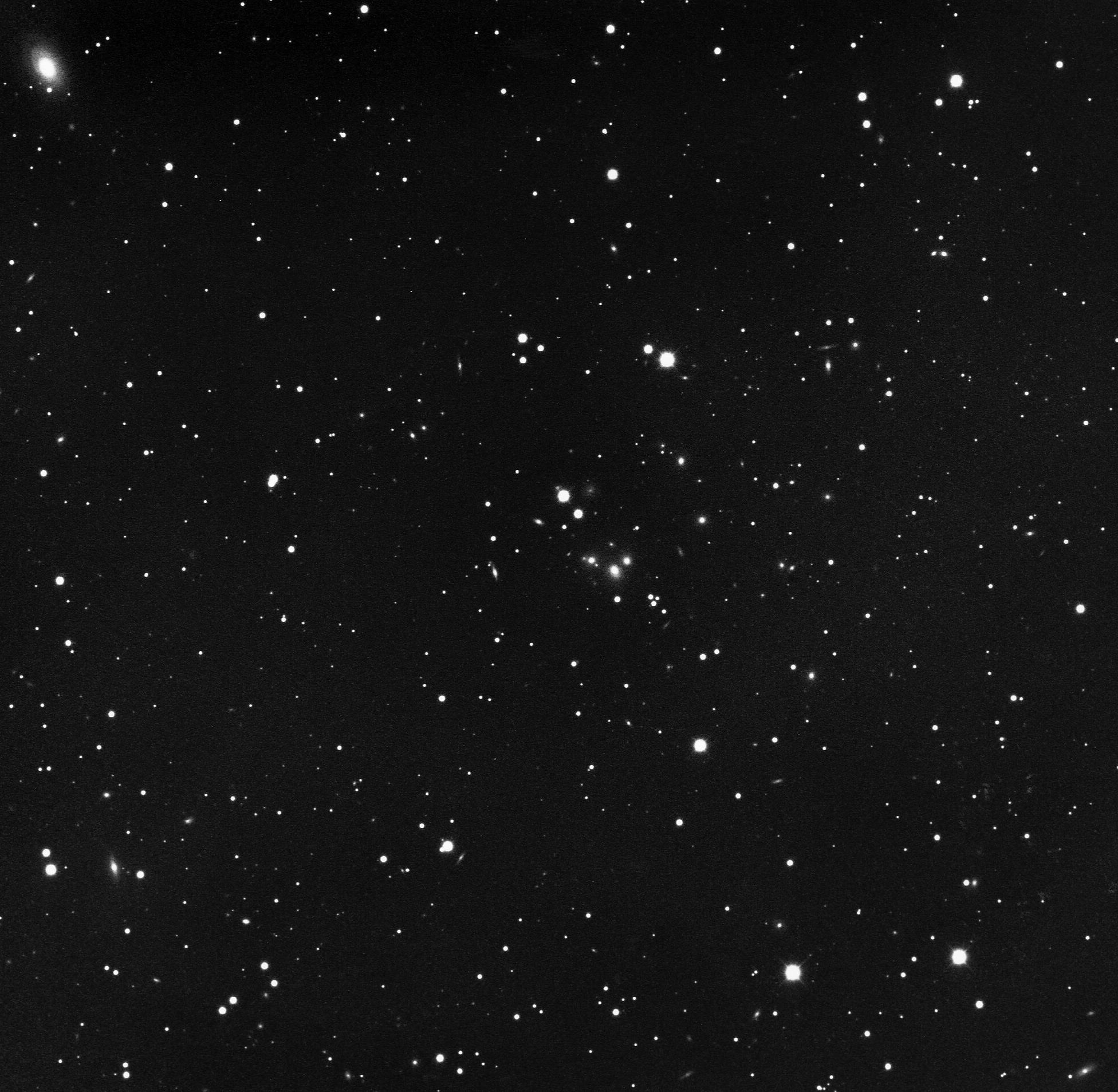 A black and white photo of a cluster of stars.