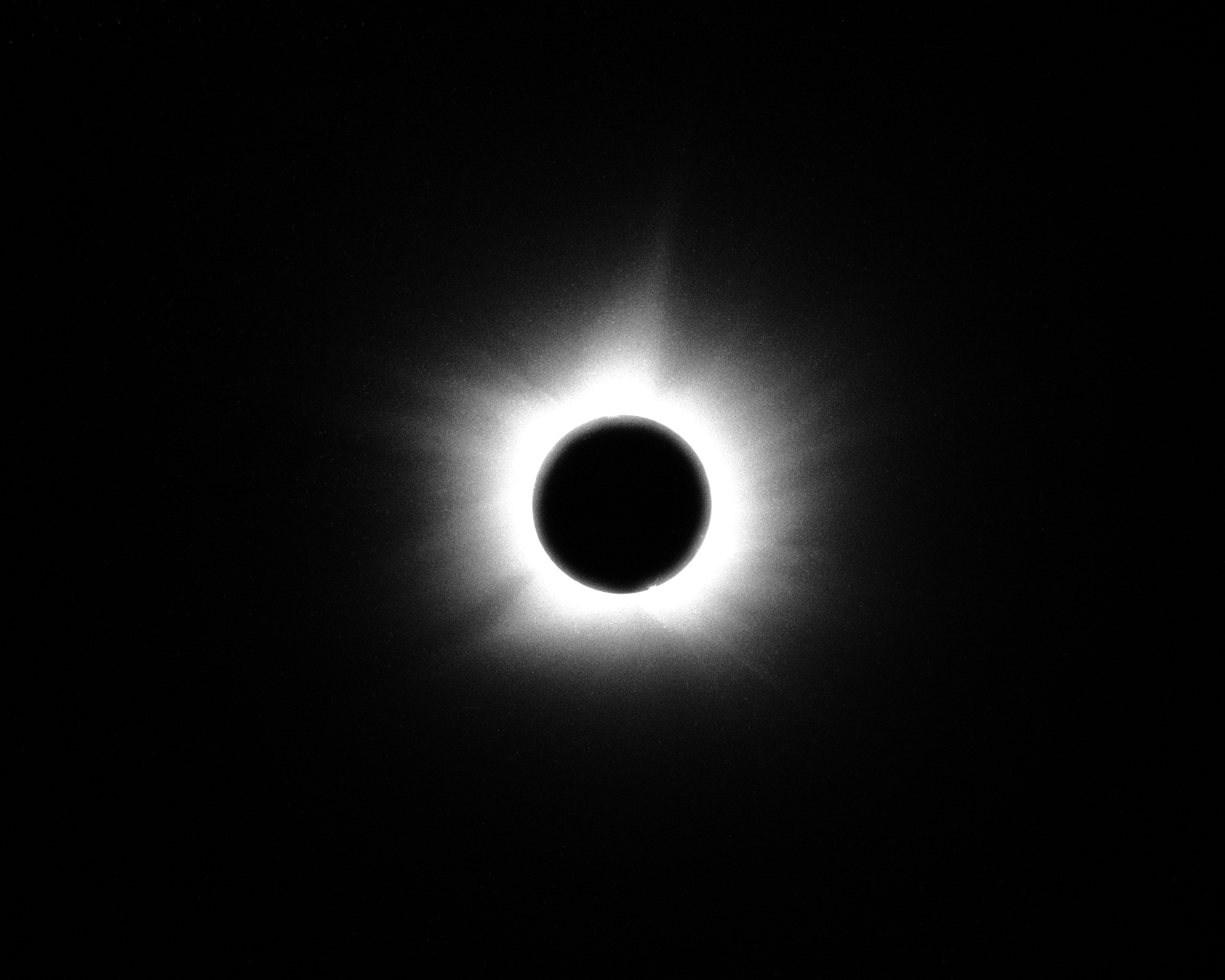 A total eclipse with the moon blocking the sun, creating a corona effect.