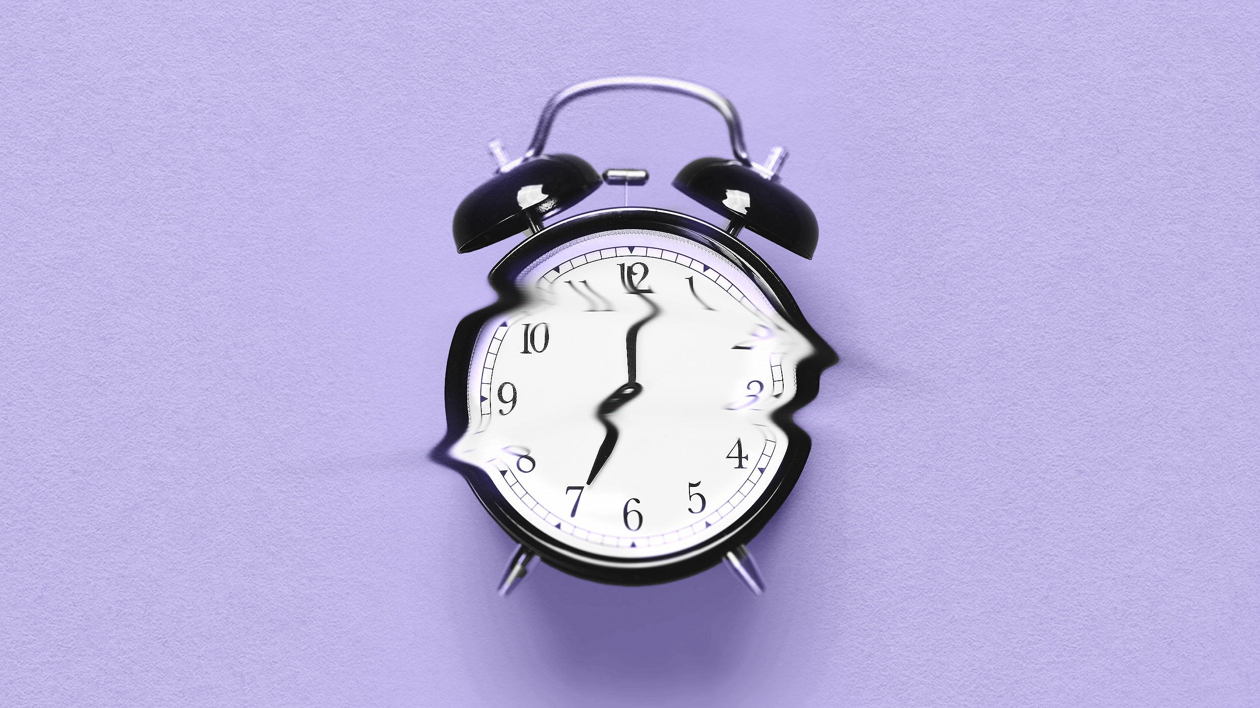A broken alarm clock on a purple background, reminiscent of a Tali Sharot study.