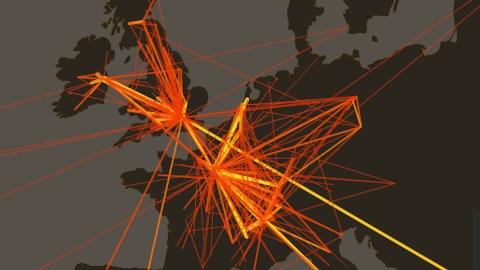 A graphical representation of network connections superimposed on a dark map, highlighting major nodes with bright orange and yellow lines.