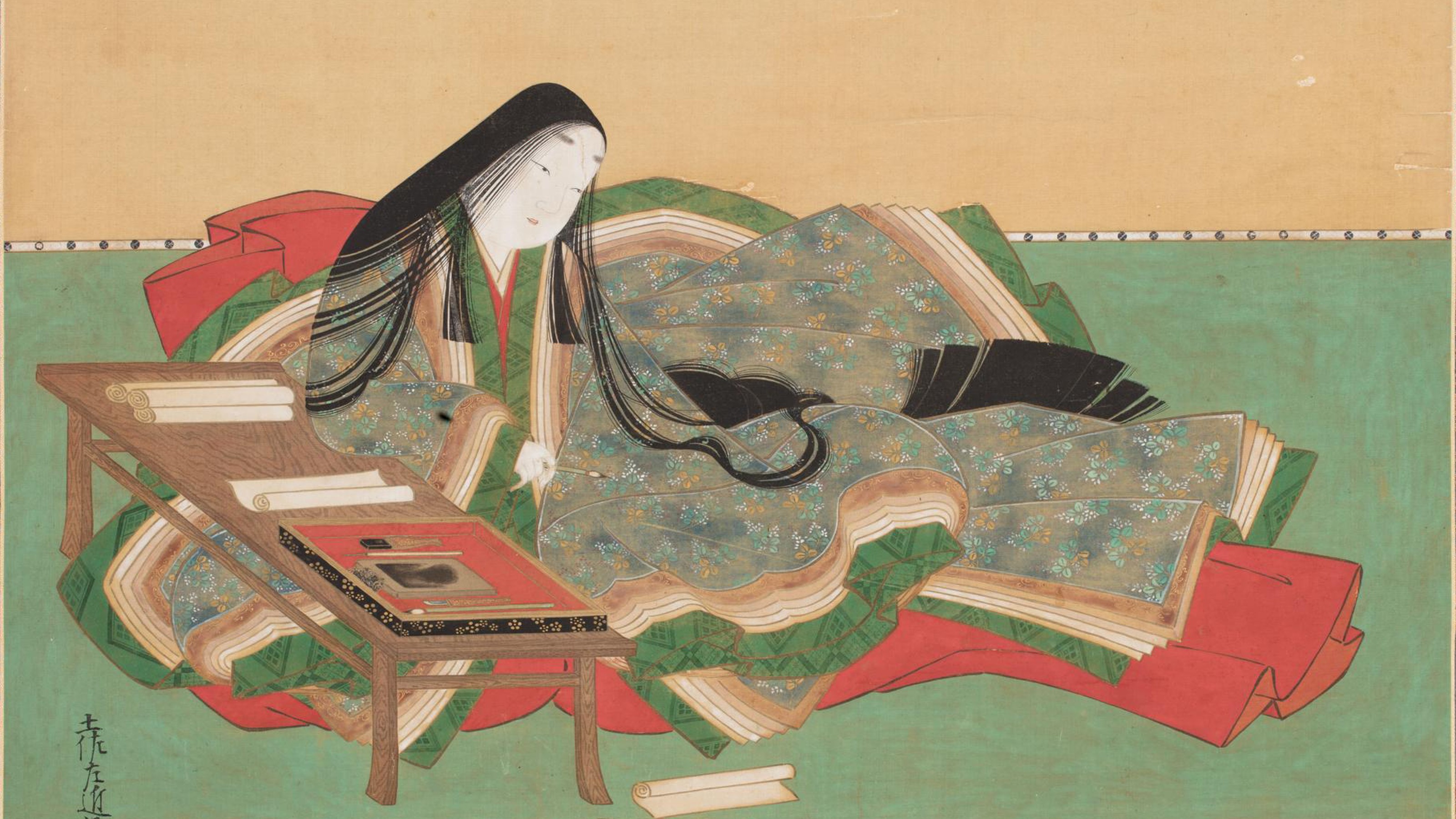 A traditional Japanese painting depicts a woman in a colorful kimono seated on the floor, reading a book beside a small wooden table with scrolls and an ink set.
