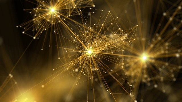 Abstract image of interconnected golden lines and nodes forming complex geometric patterns against a dark background, resembling a neural network or web.