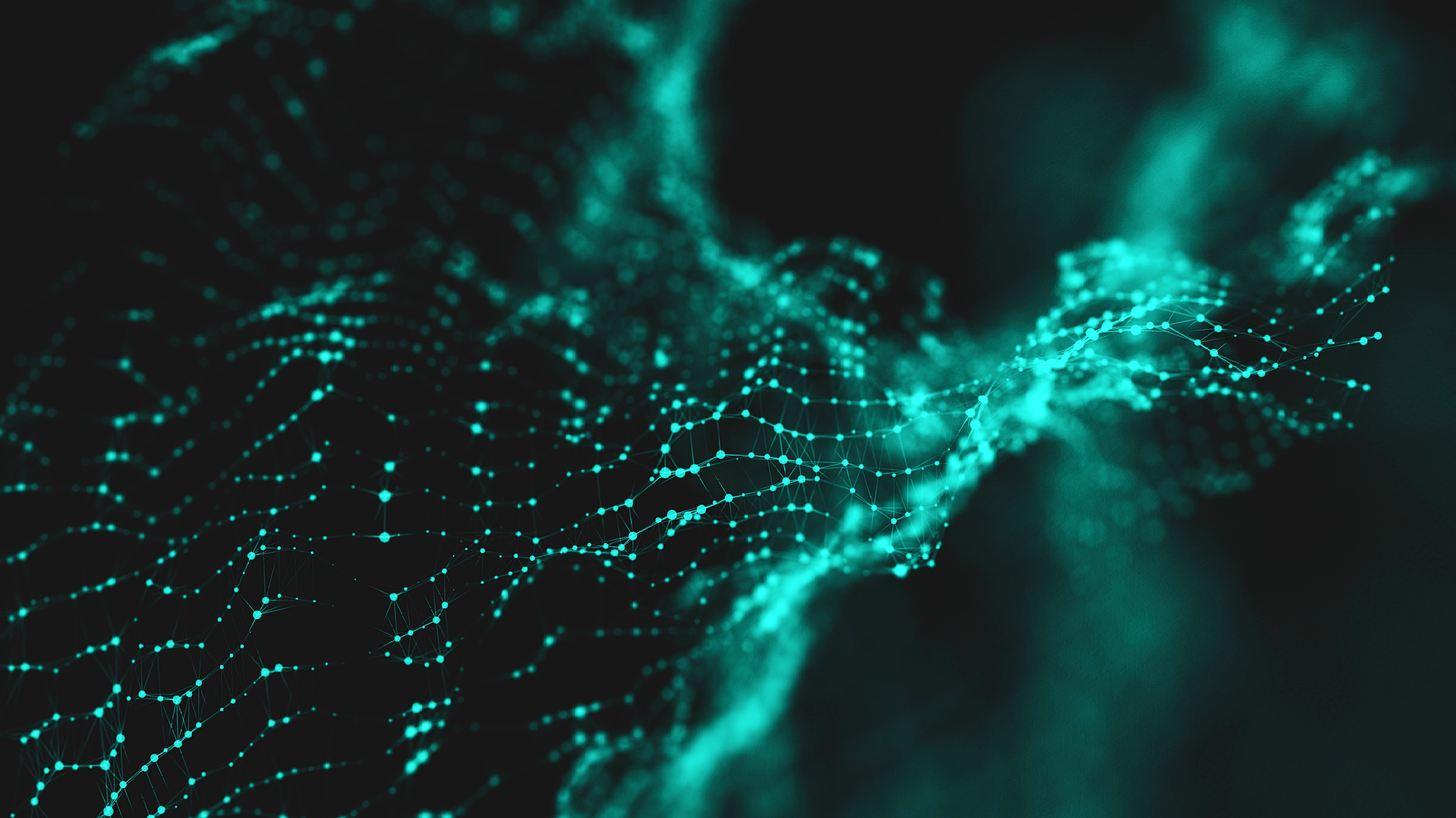 A digital abstract image featuring a network of interconnected glowing teal nodes on a dark background, resembling a wave or web structure.