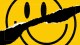 A yellow smiley face with a black, diagonal tear running across the center, creating a disrupted appearance.