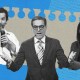 Three individuals, one with a microphone, another in a suit and glasses, and the third gesturing with one hand raised, are juxtaposed against a blue background with a torn paper design, promoting ATD 2024.