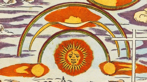 A colorful, vintage illustration of the sun with a face surrounded by 3 rainbow and various clouds.