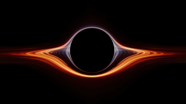 A digital rendering of a black hole with a glowing, distorted light accretion disk around its event horizon in space, set against a pitch-black background.