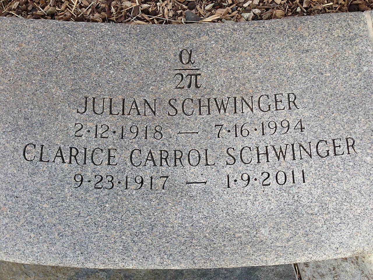 Engraved headstone for Julian Schwinger (1918-1994), known for his work to solve muon g-2, and Clarice Carrol Schwinger (1917-2011), featuring their birth and death dates.