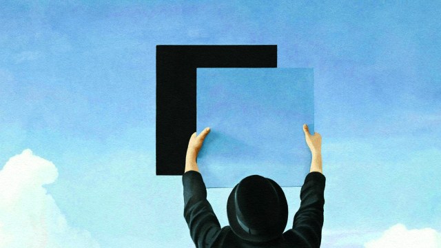 A person in a black hat and coat raises a black square and a blue square against a clear sky, symbolizing their moral ambition.