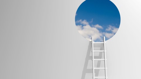 A white ladder leans against a white wall, leading up to a circular opening revealing a blue sky with scattered clouds.