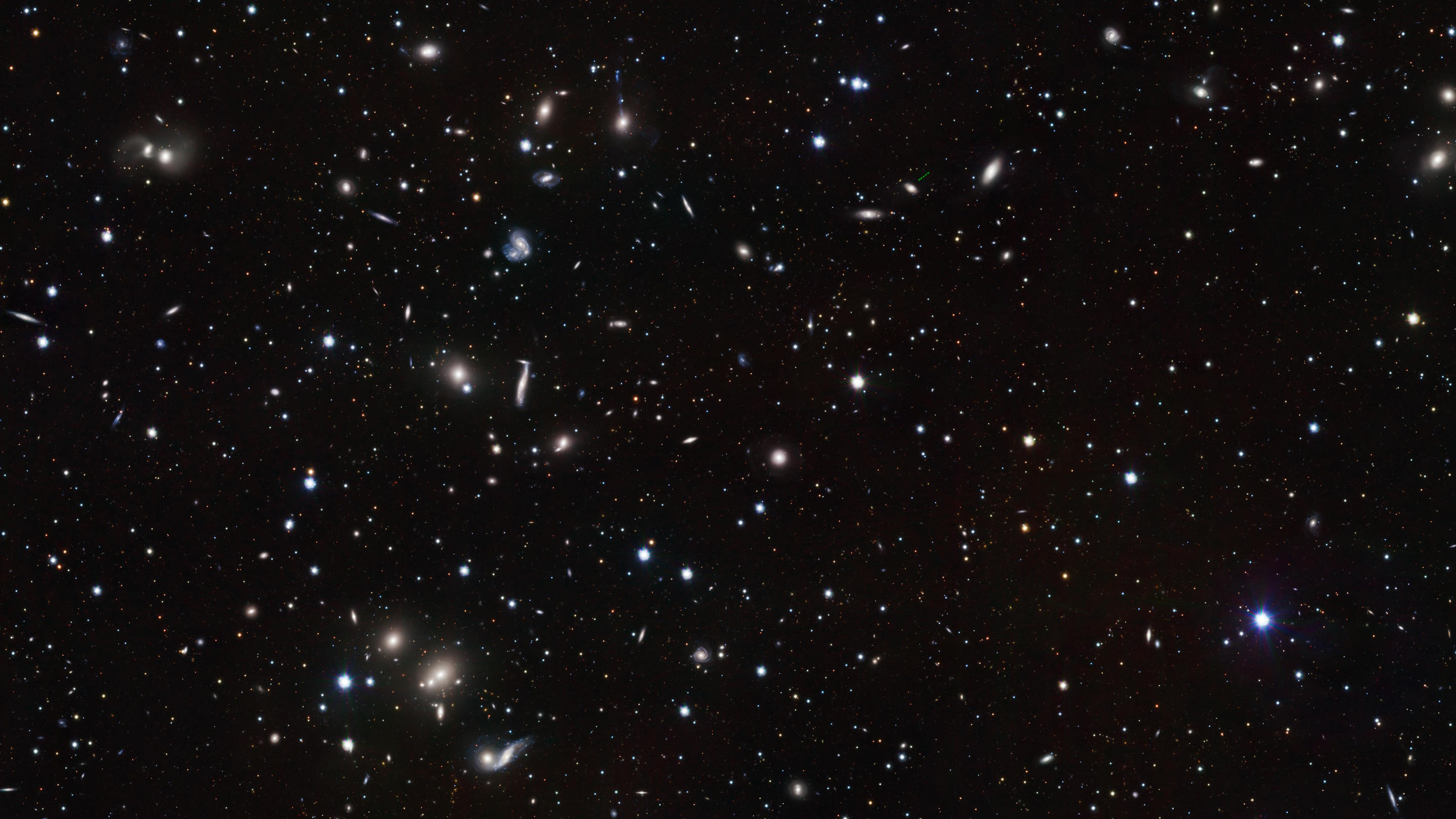 A vast expanse of outer space densely populated with numerous stars, including the typical star, and celestial objects of varying brightness against a dark background.